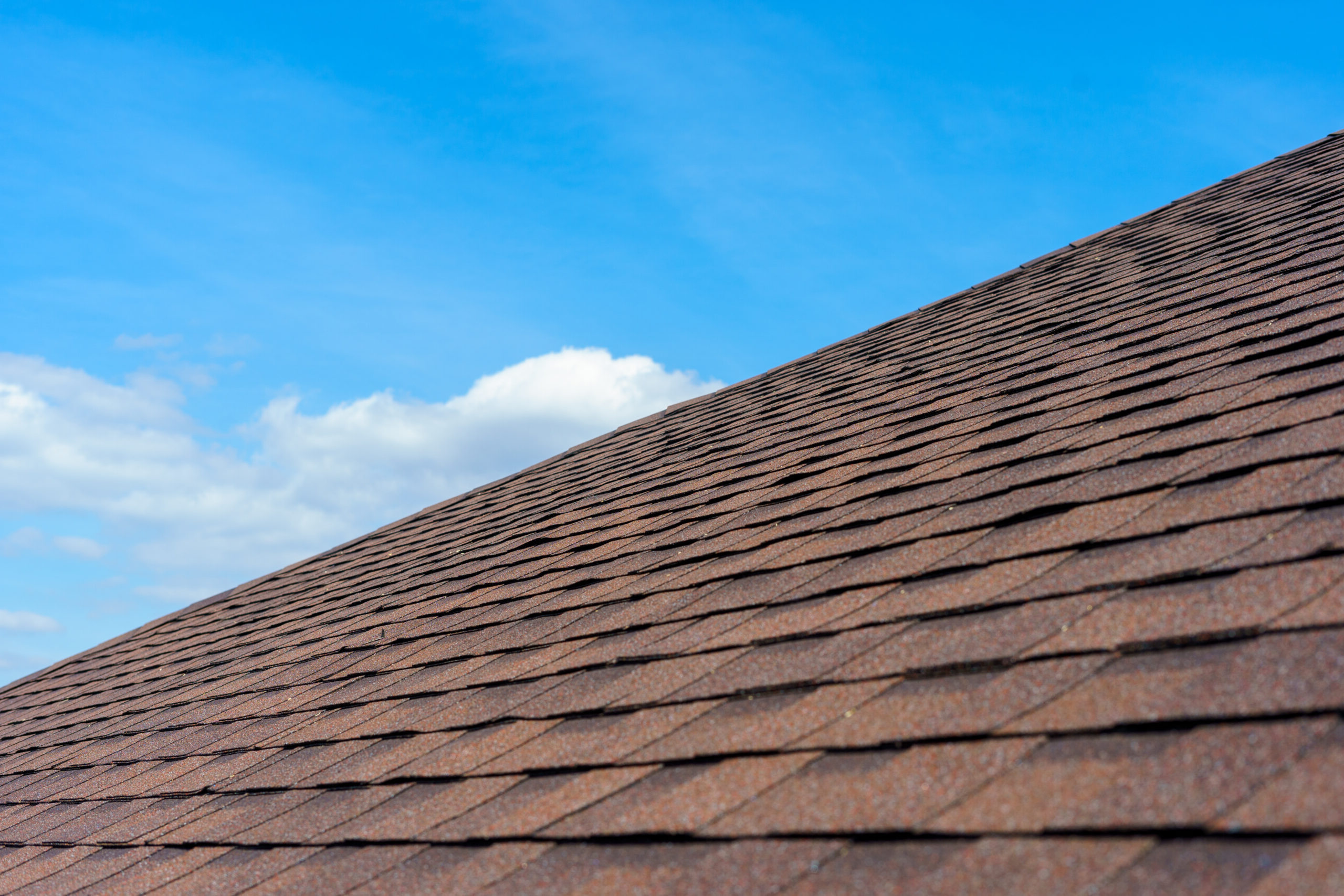Asphalt Shingle Roof Blue sky and Residential brown roof