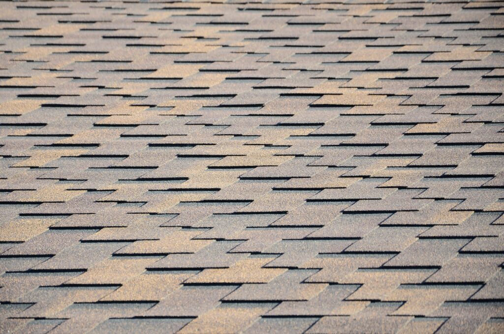 Modern roofing and decoration of chimneys. Asphalt shingles